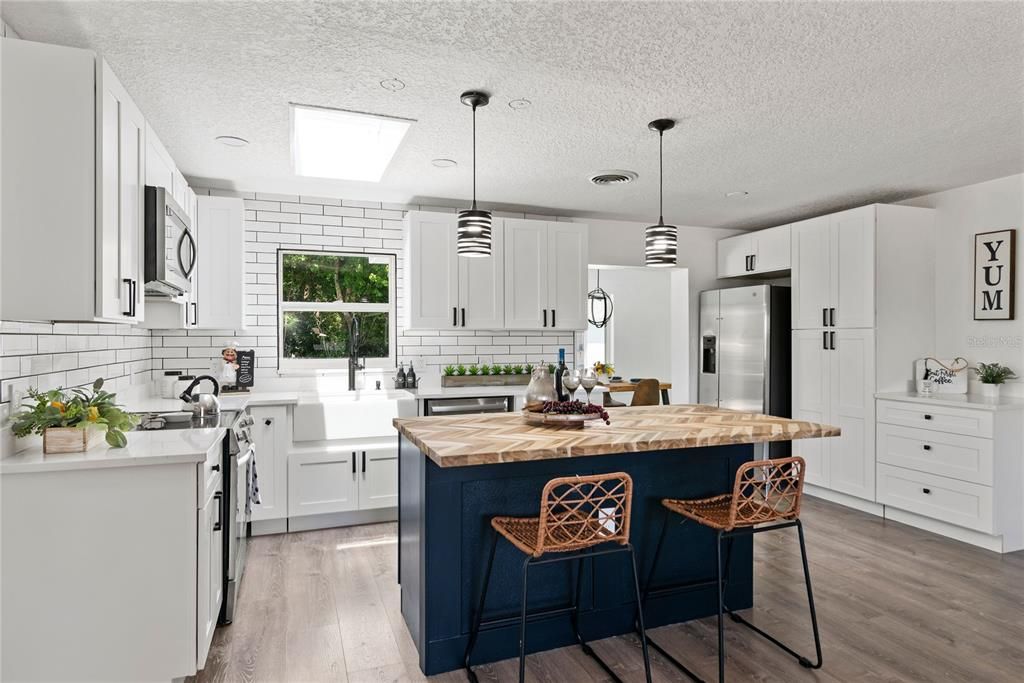 Cook up delicious meals in this modern kitchen with lots of room to move around. There's plenty of space for everyone to help out or grab a snack