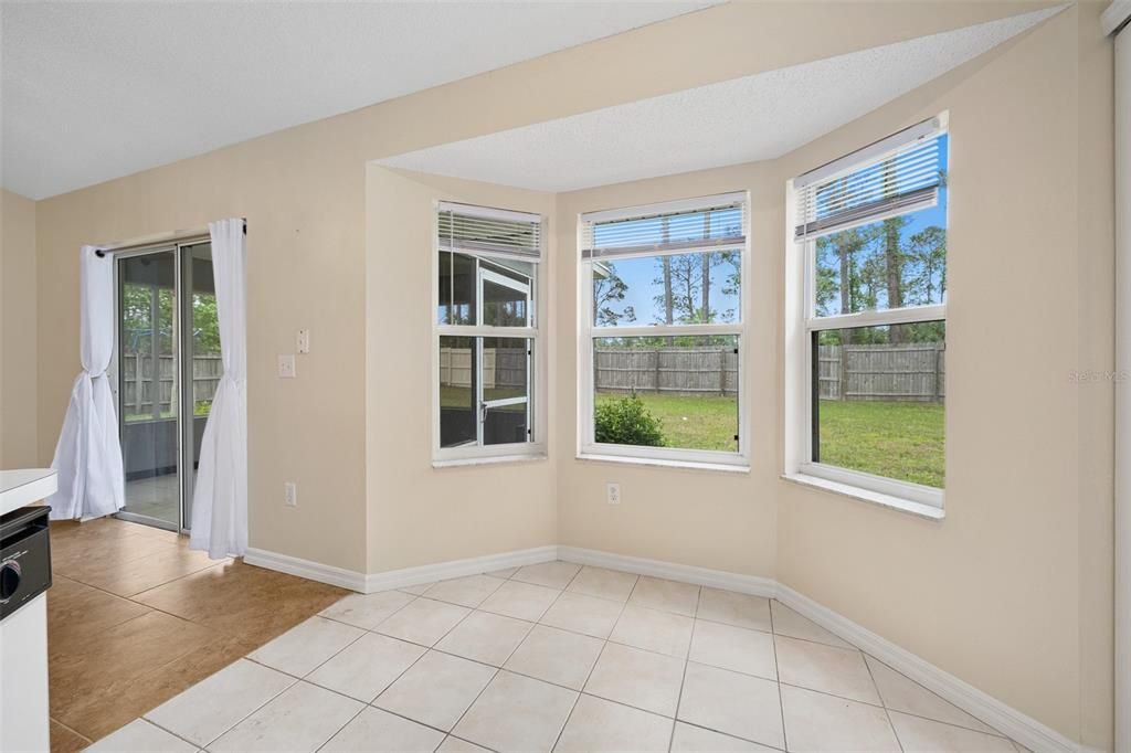 Room for a dinette table while overlooking backyard