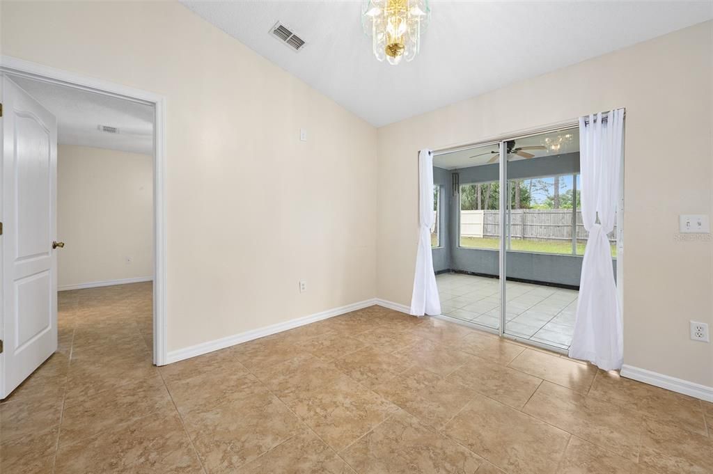 Dining area with slider leading to porch