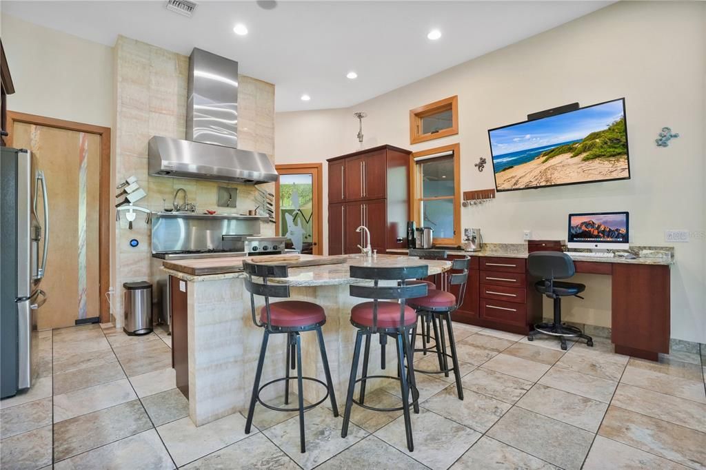 The extended Jaguar print granite counter top features a desk and coffee bar.