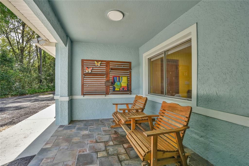 In-Law residence convered front porch...the ideal location to enjoy a favorite libation.