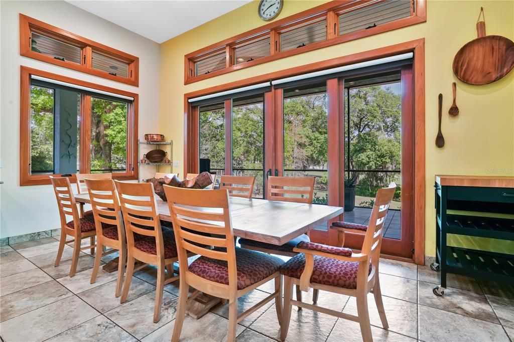 The dining room is conveniently located adjacent to the kitchen offering commanding views of the serene backyard...the ideal location to entertain your guests.