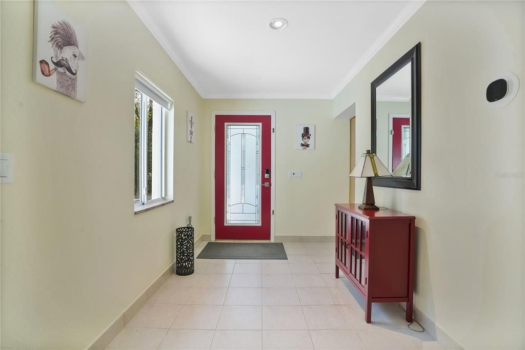 In-Law residence front door & foyer.  The ideal residence for a multi-family / multi-generational residential need or as an income producing rental.  Currently rented until May 15, 2024 for $1,600 per month.