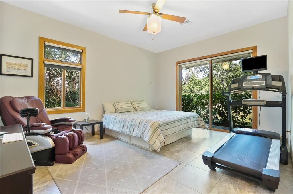 2nd bedroom with serene views of the backyard.