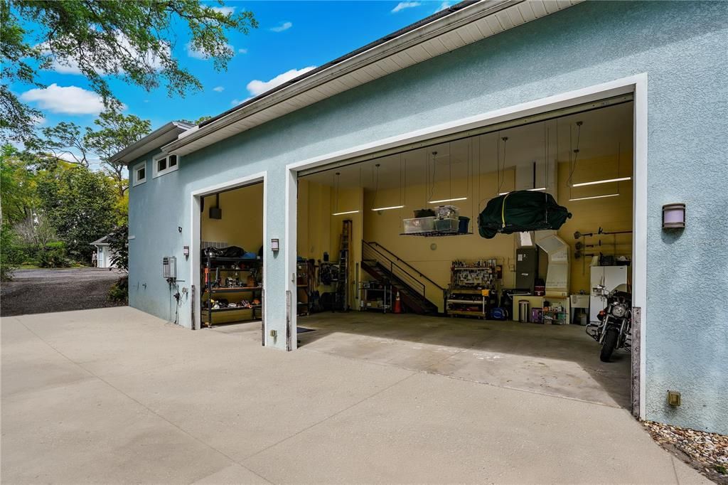 The oversized 25'x34' main house side entry garage with 16' ceilings and 12' roll up motorized garage doors can easily accommodate several car lifts and is perfect to house your exotic automobile collection, RV, ATV's, Motorcycles, or workshop.