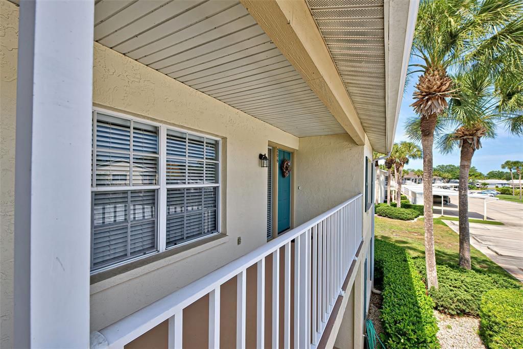 Covered walkway welcomes you.  Condo would be a fantastic investment if rented, would be wonderful year-round or a perfect to enjoy our sunny, warm winters.