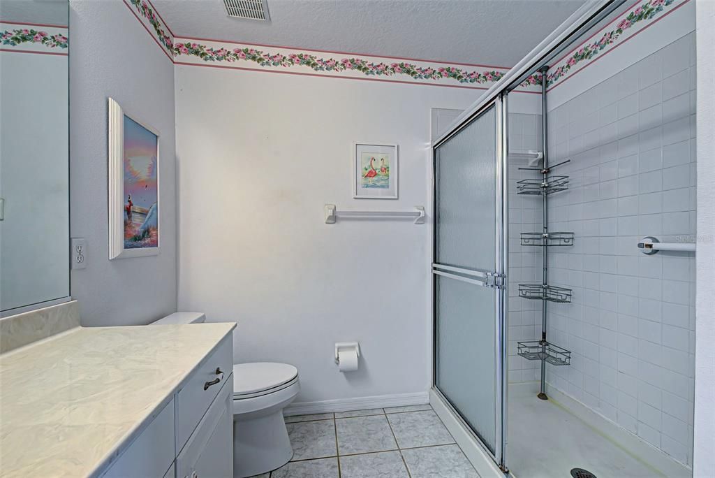 Walk in shower in the primary bathroom.