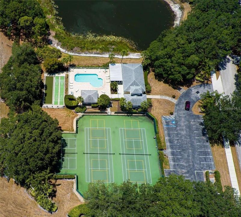 Bird's eye view of Waterside Village's clubhouse, community pool and pickleball courts.