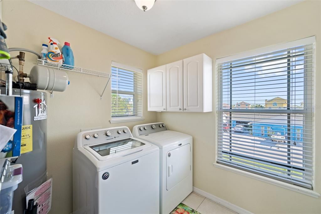 Laundry Room is adjacent to the kitchen, on the 2nd floor, complete with a closet-style pantry & additional storage cabinets.
