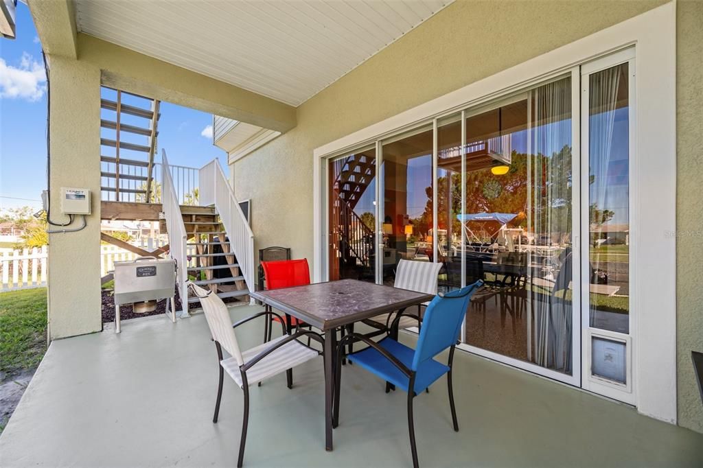 Huge covered rear patio is perfect for entertaining, rain or shine! There is an exterior staircase + Cargo Lift up to 1,000 pounds for convenience!