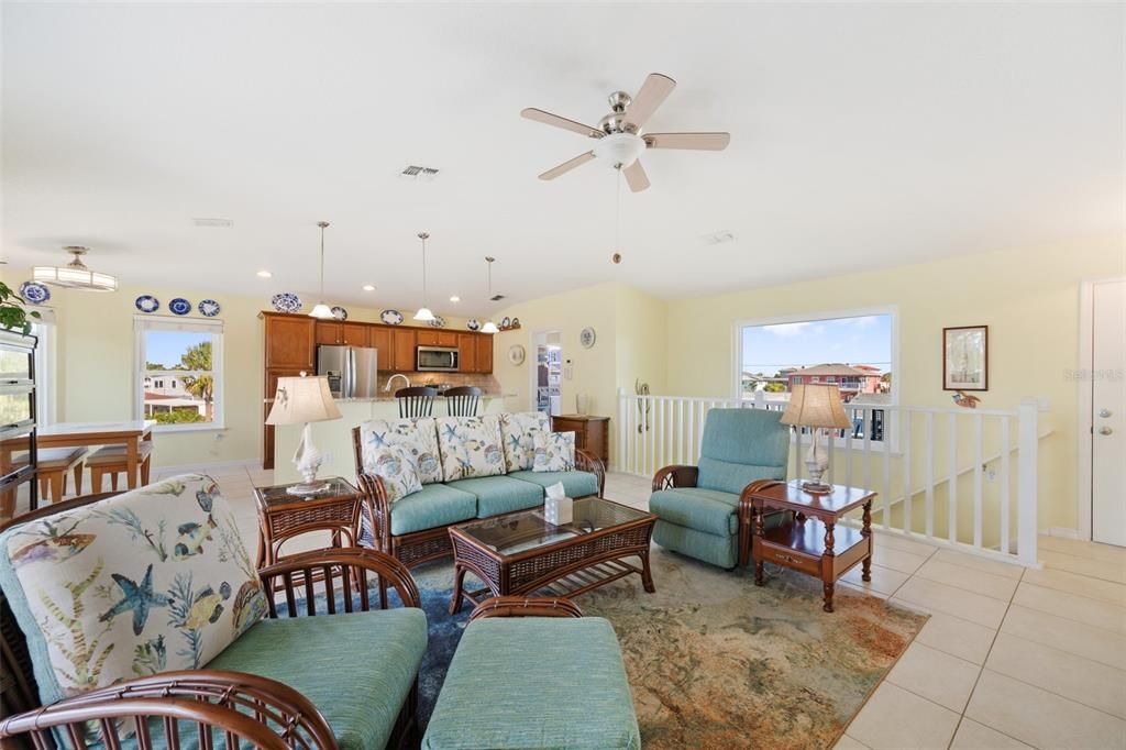 The open concept on the 2nd floor is light & bright with large windows & cathedral ceilings!