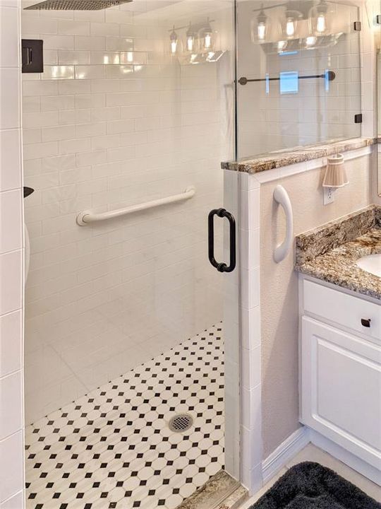 an ensuite bath complete with a shower enclosure