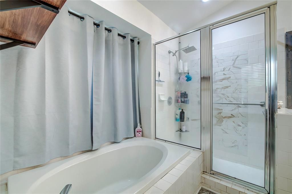 Large shower stall separate from the garden tub