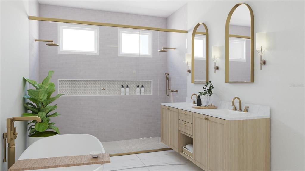Primary bath with soaking tub and double vanities.