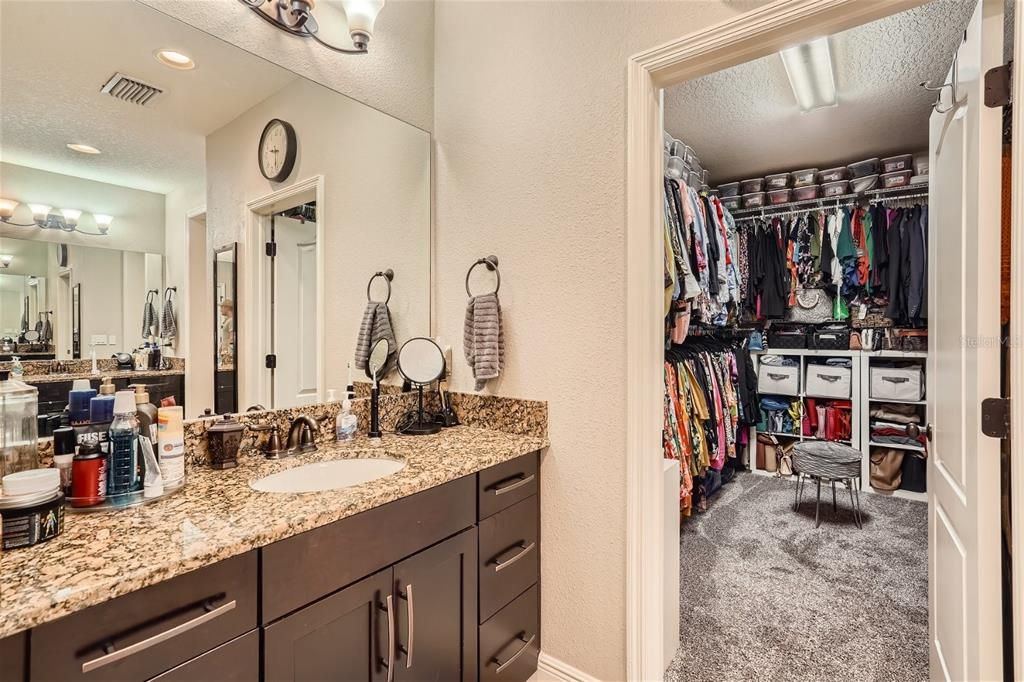 Owner's bath and glimpse into the walk-in closet that is to die for!