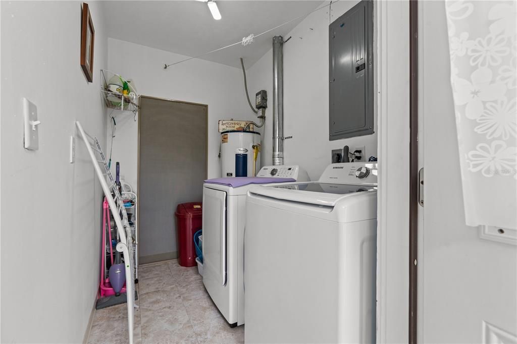 Laundry room includes washer and dryer and shows new electrical in 2023.