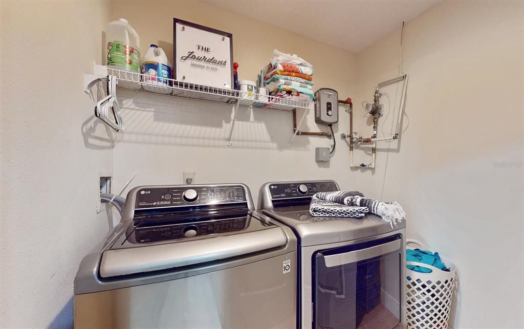 SPACIOUS LAUNDRY ROOM WITH WASHER AND DRYER
