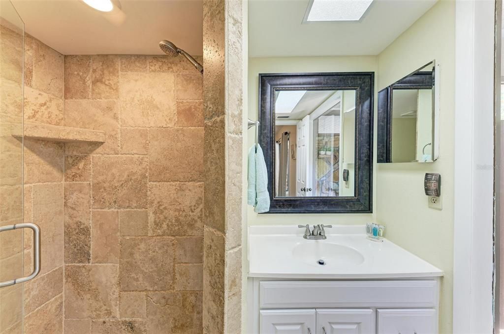 Primary en-suite bathroom with walk in shower