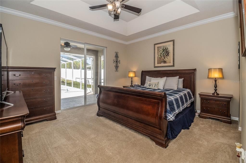 MASTER BEDROOM WITH SLIDERS TO POOL AREA