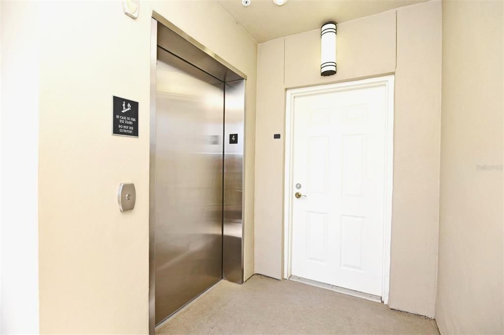 Elevator with Storage Room Door
