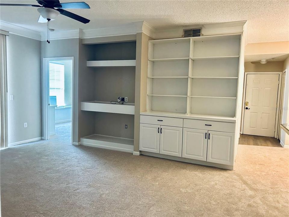 Living/Great Room with built in shelving & Custom Cabinet