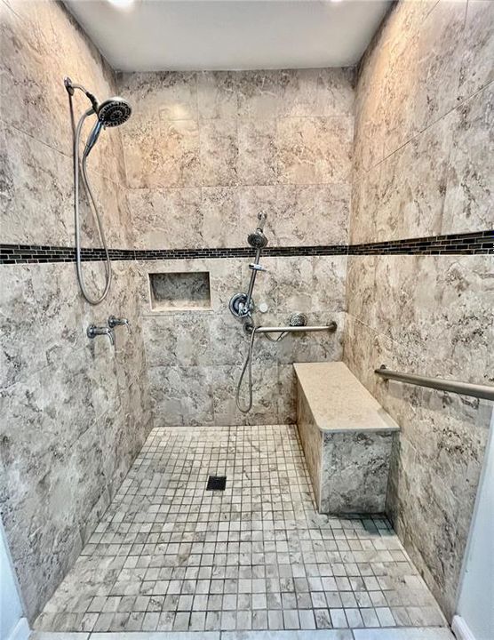Upgraded walk/roll in Show with built in bench & extra shower heads