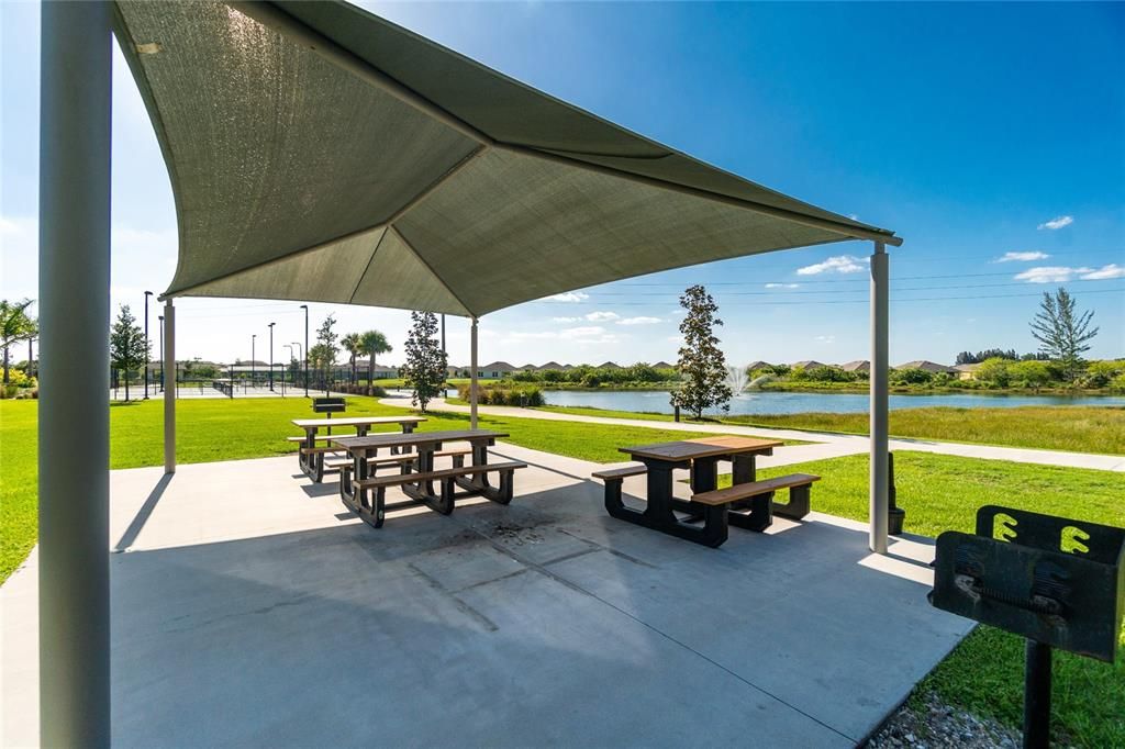 Rest area with barbeque grilling stations overlooking one of the community lakes.