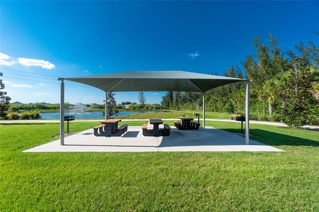 Rest area with barbeque grilling stations overlooking one of the community lakes.