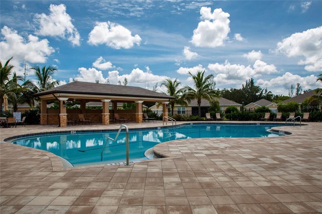 Pool area with restrooms in the background.