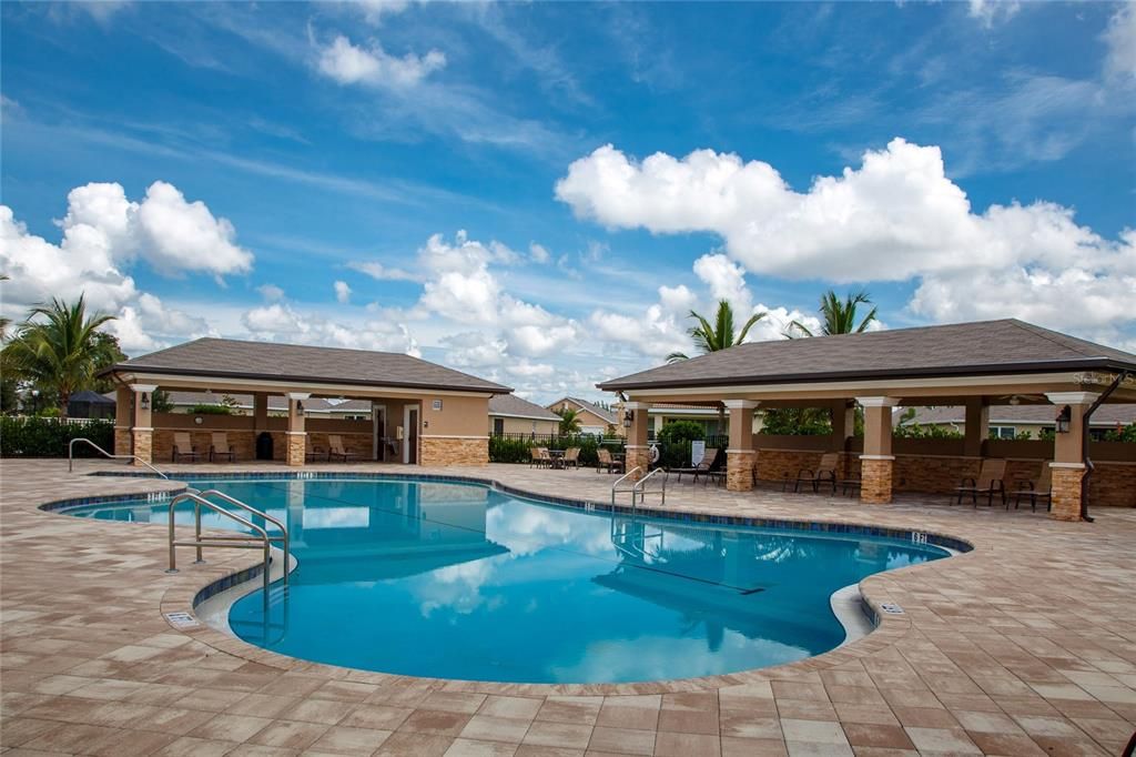 Pool area with restrooms in the background.