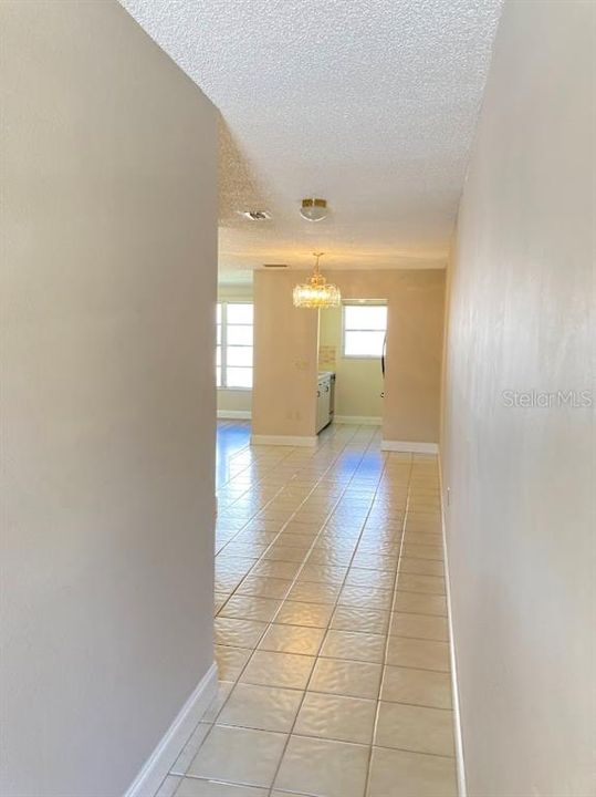 Looking at the dining area, kitchen entry and living room