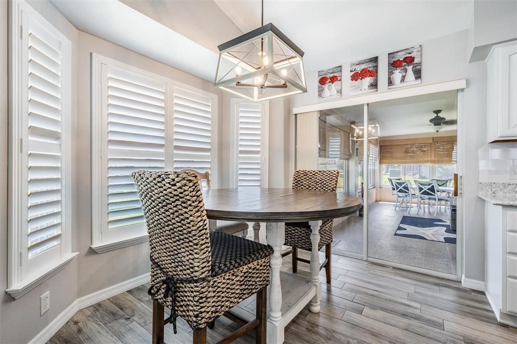 Breakfast nook with plantation shutters and access to lanai