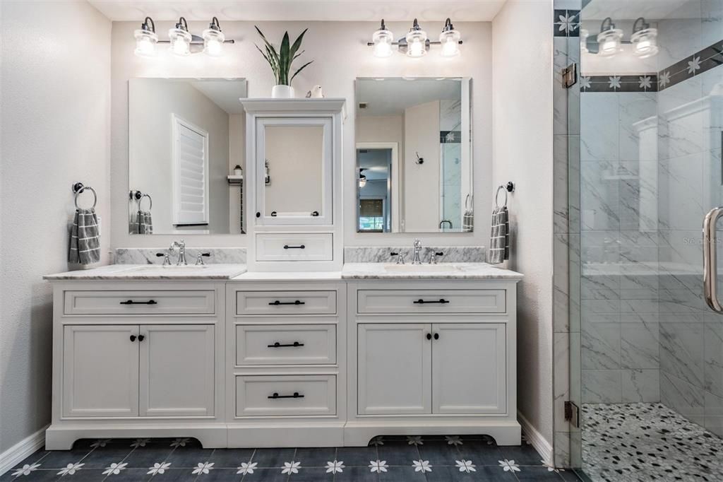 Upgraded master bath details include this grand double vanity and oversized step-in shower.