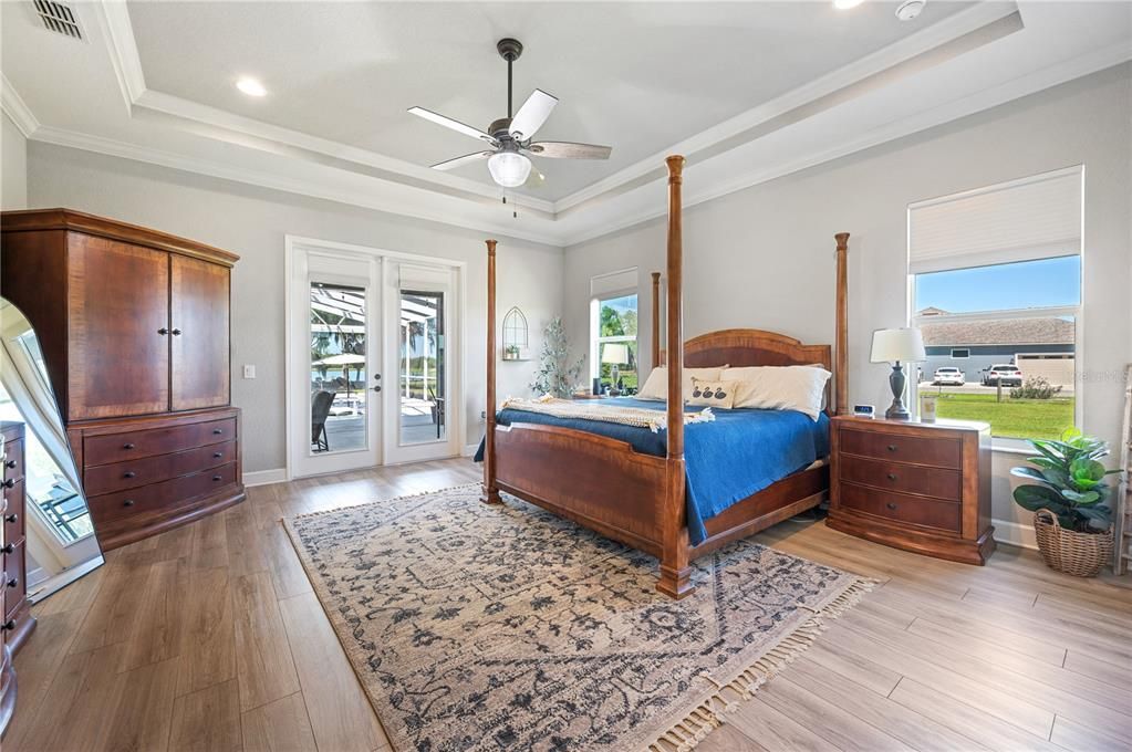 Primary Bedroom with french doors to pool and Lake views!