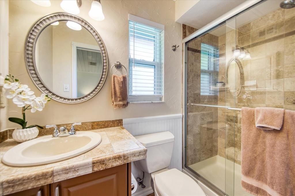 Updated master bathroom with shower & sturdy glass doors~