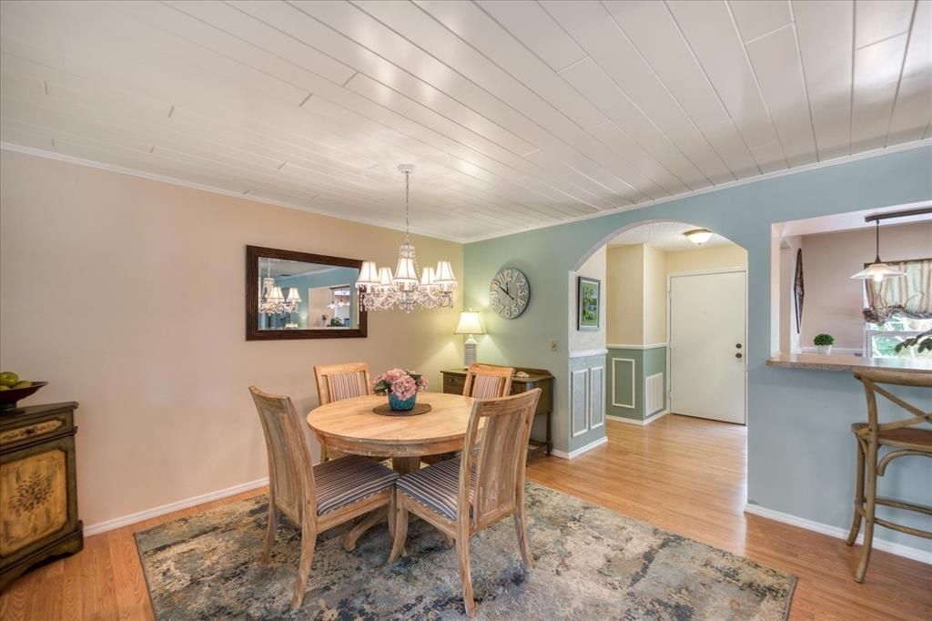 Arched opening & shiplap ceilings with crown edge add architectural interest~