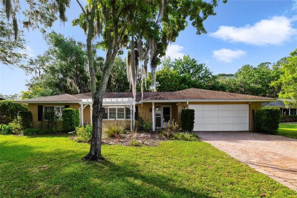 Endless potential on a large .67 ACRE LOT in a beautiful community just off Lakeshore Dr/Lake Dora offering a NEWER ROOF (2019), UPDATED A/C (2023), FRESHLY PAINTED INTERIOR and a LOW HOA!