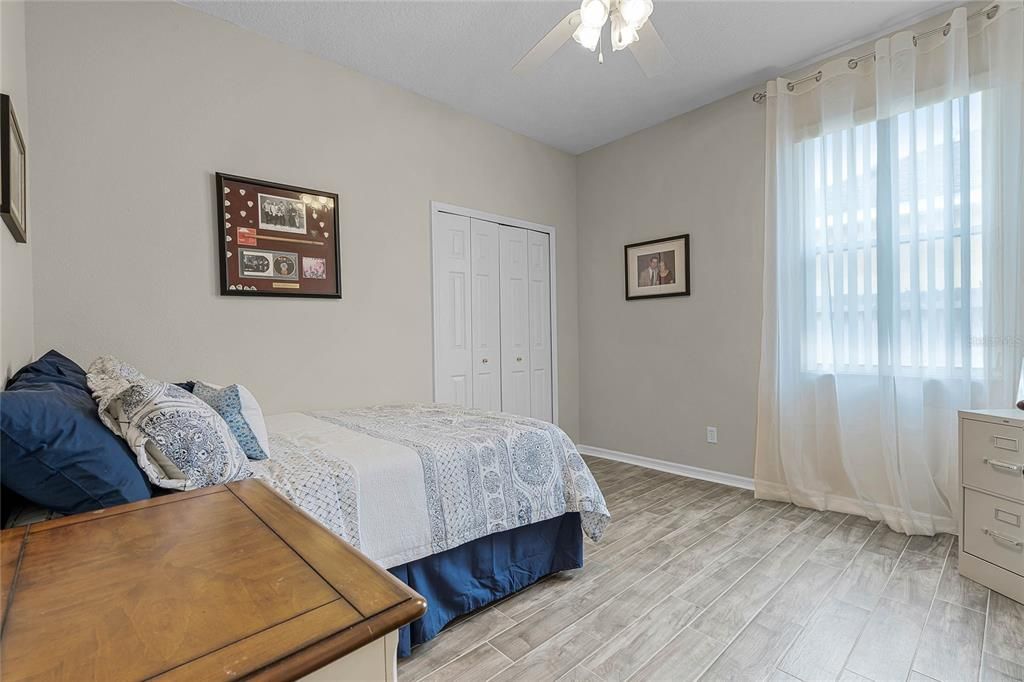 Bedroom 4 with newer porcelain tile flooring replaced 2019