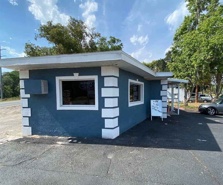 Commercial building. Previously used as restaurant, convenience store and most recently vacuum sales and service. Newer roof, Central Heat and AC