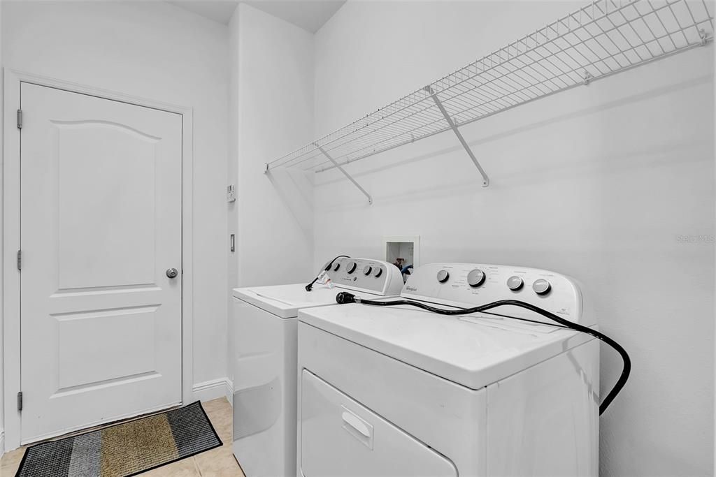 Laundry room leading to garage
