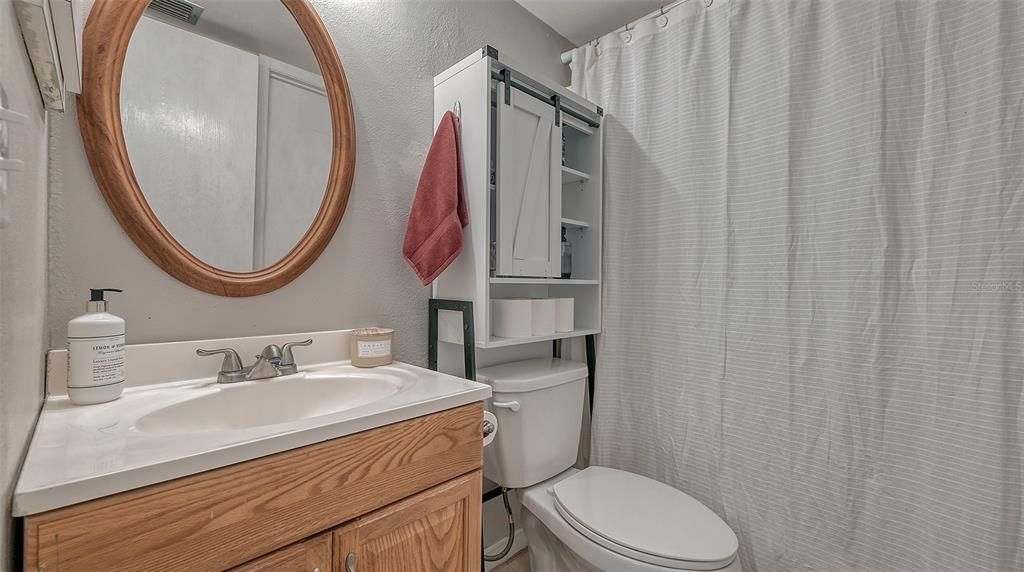 Primary bathroom with shower/tub combination.