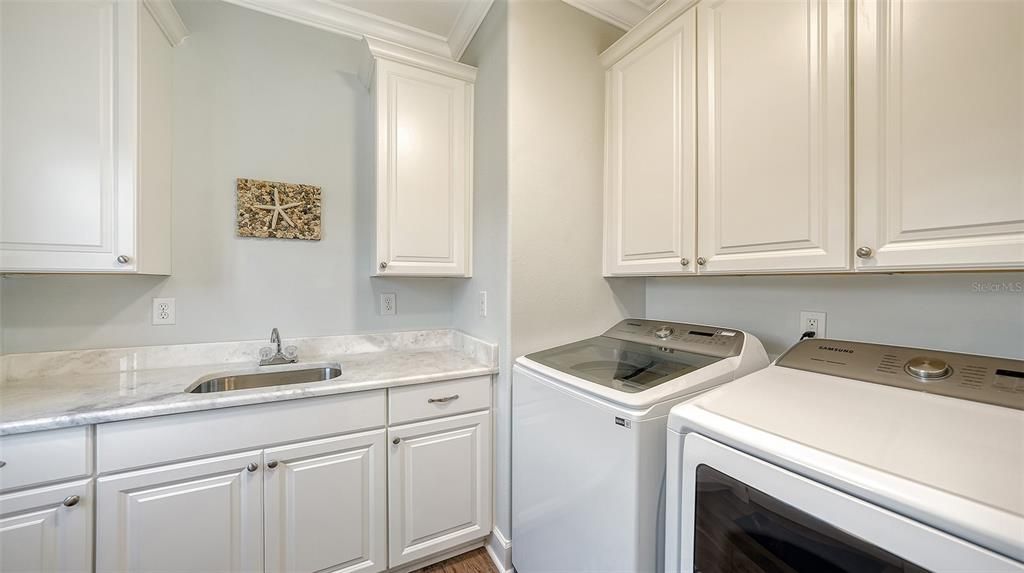 Laundry room with sink.