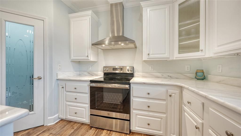 Stainless appliances and exhaust hood.