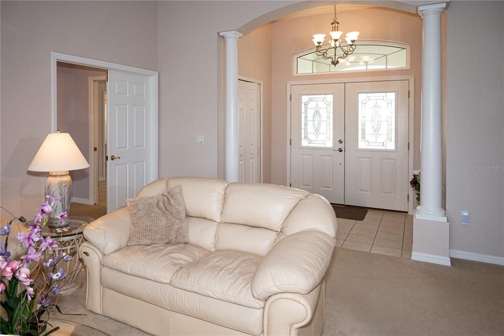 Living Room with double doors on the left to the Primary Suite