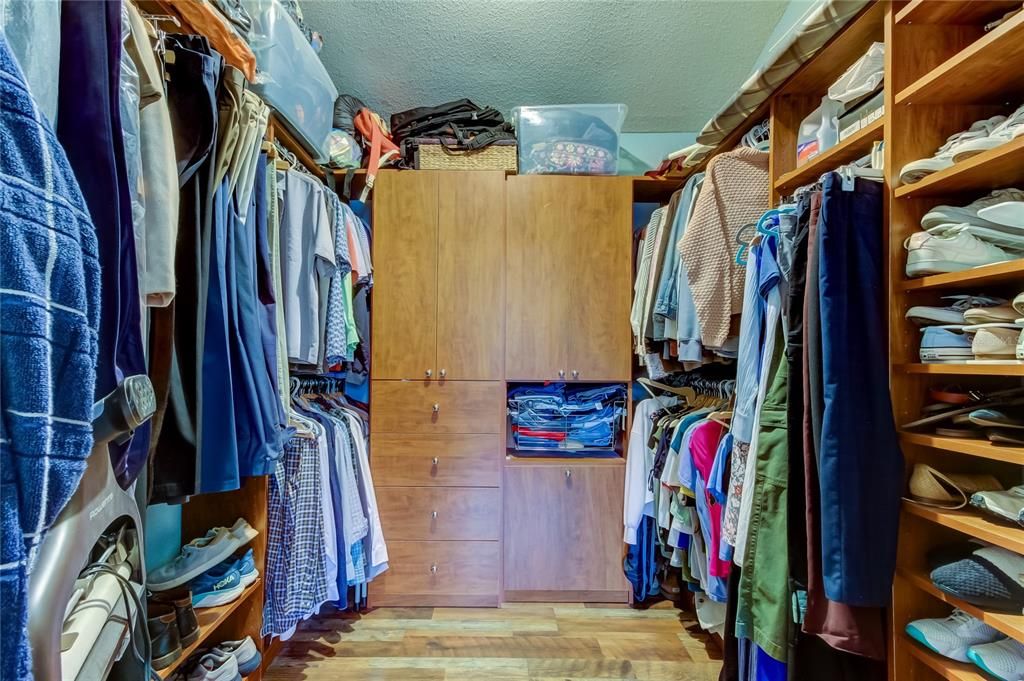 Primary bedroom walk-in closet