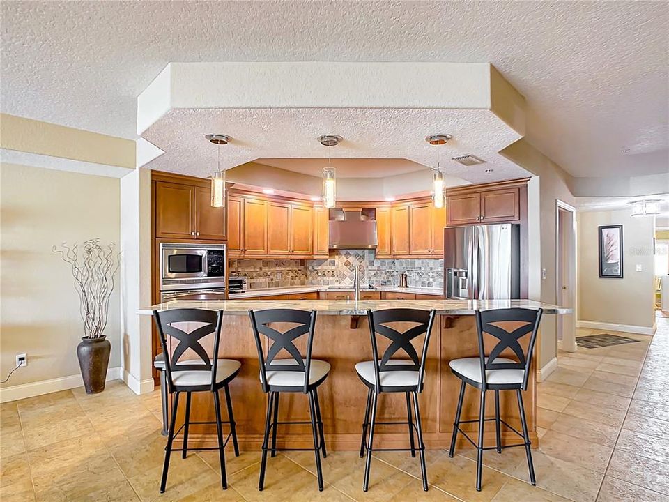 The breakfast bar offers additional sitting for entertaining.