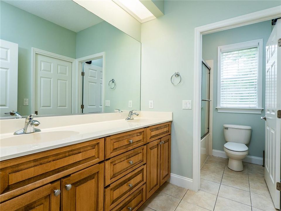 Bathroom with double sinks located between Bedroom 2 and 3