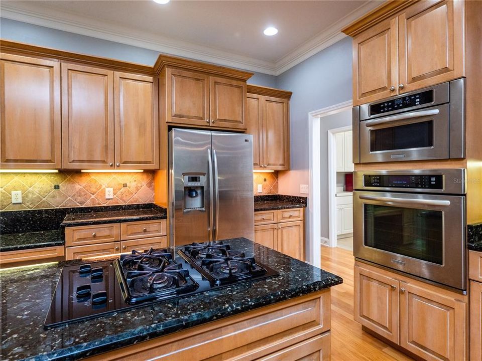 Kitchen with granite countertops and cook island