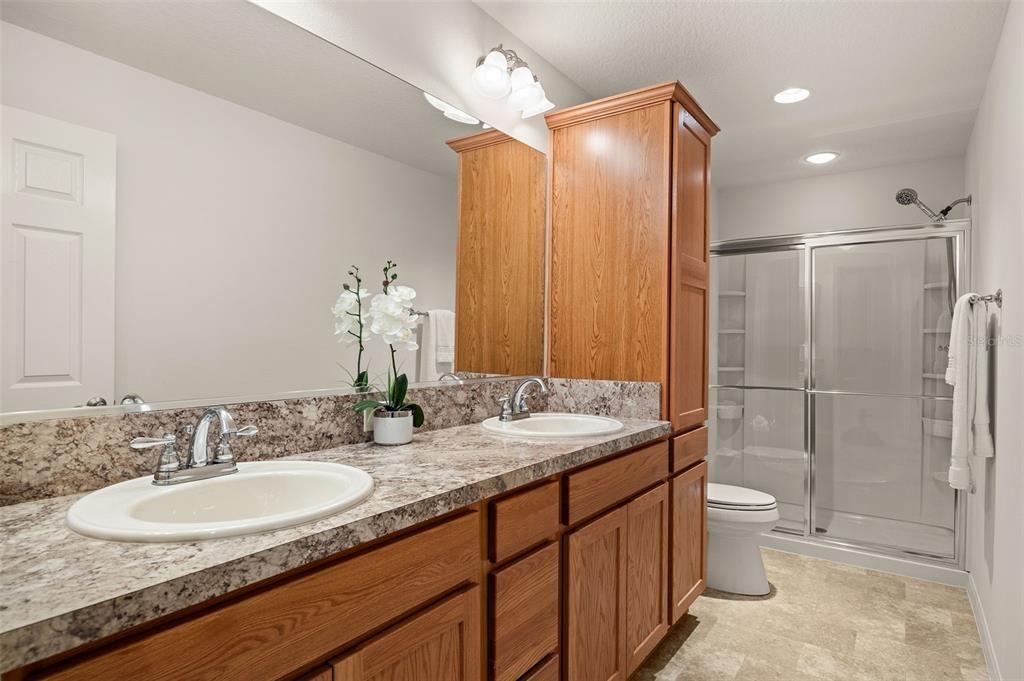 Spacious ensuite with dual sinks and walk in shower.
