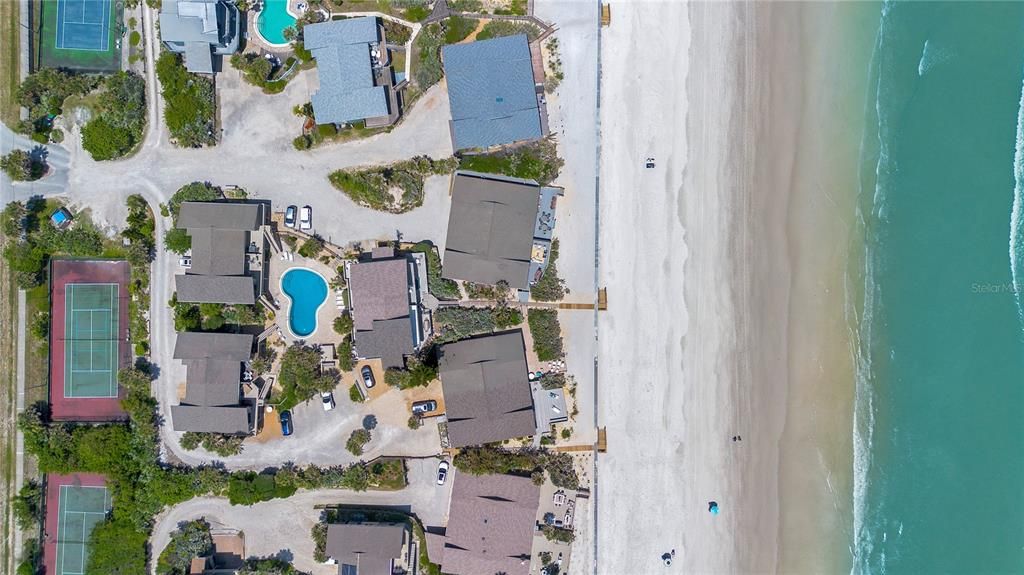Aerial views directly over home and showing Dolphin Community with Pool and Tennis/Pickleball Court.